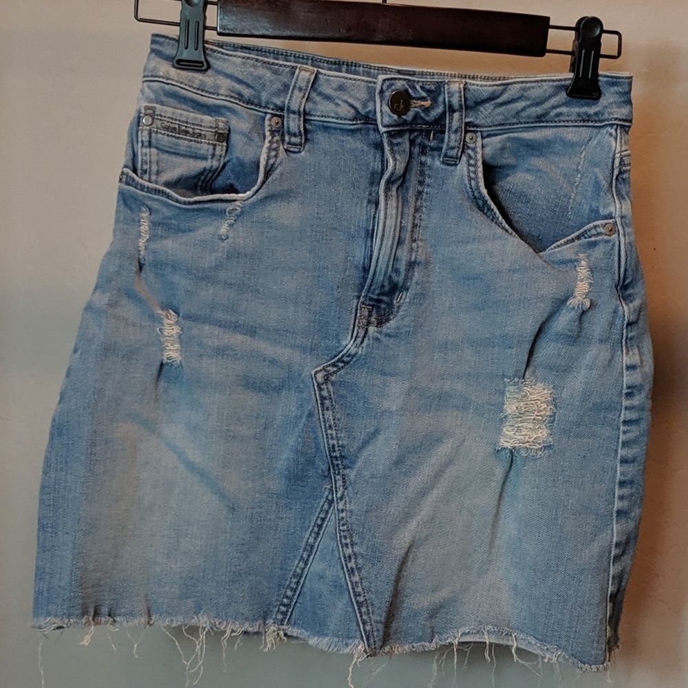 Calvin Klein: Light wash distressed denim skirt